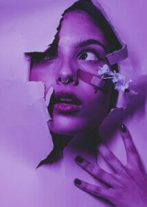 Portrait of Woman Breaking Through Wall